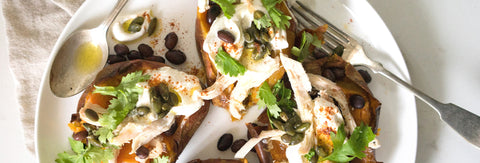 Loaded Sweet Potatoes with Spiced Orange Yogurt and Warm Pumpkin Seed Dressing Over Shredded Chicken 